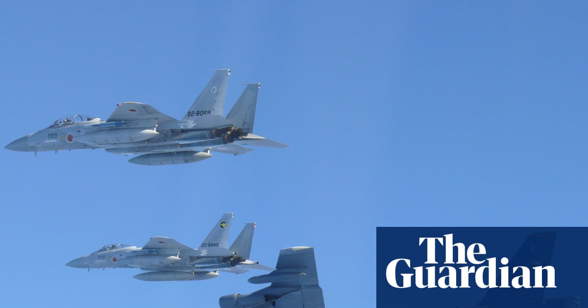 Japan Approves Record Defence Budget Amid Rising Tensions with China image from theguardian.com