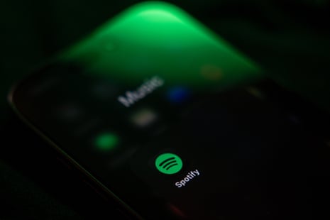 AI-Generated Songs Top Spotify Charts Amidst Rising Uploads and Removal Controversies image from theguardian.com