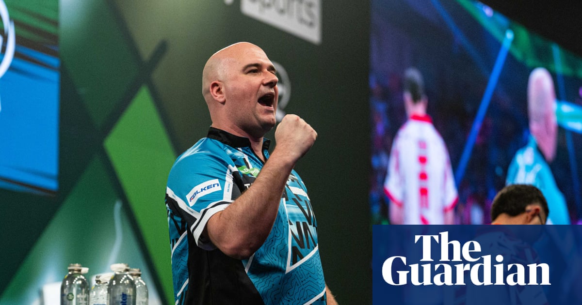 Rob Cross, Gary Anderson, and Ryan Searle Progress to the Last 16 at the PDC World Darts Championship image from theguardian.com