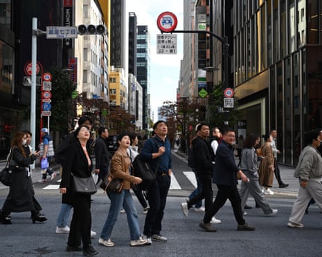 China Issues Travel Warning to Japan Amid Diplomatic Row, Impacting Japanese Markets image from theguardian.com